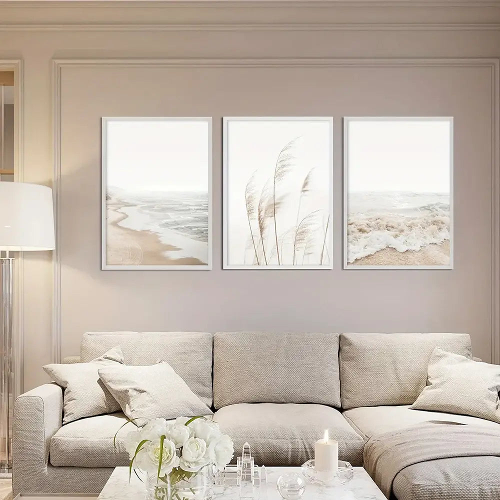 Three framed decorbites™ nordic seascape canvas wall art prints featuring minimalist beige and white beach scenes