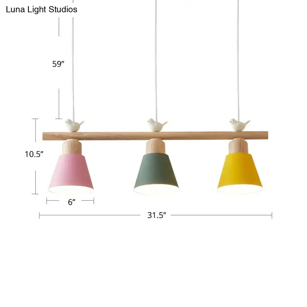 Pastel-colored three-light metal pendant hanging island light with wooden bar and bird finials for dining room decor
