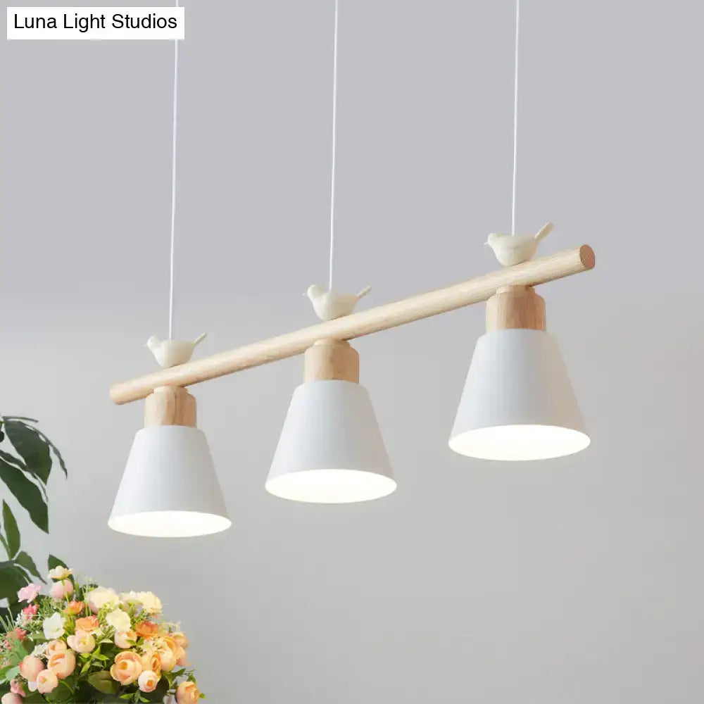 Minimalist DecorBites™ nordic hanging island light with three white metal shades and ceramic bird decor on wood beam