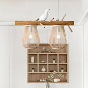 Rustic wooden beam nordic style pendant light with two woven bamboo pear-shaped shades and white ceramic bird decor