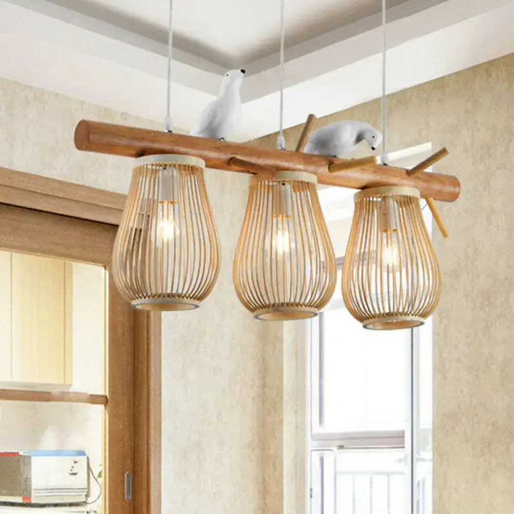 Natural wood branch nordic style pear-shaped pendant light with three woven bamboo shades and white bird decor