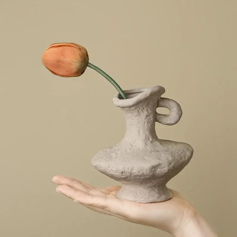 DecorBites™ nordic style ceramic flower pot in white with textured handle holds an orange tulip