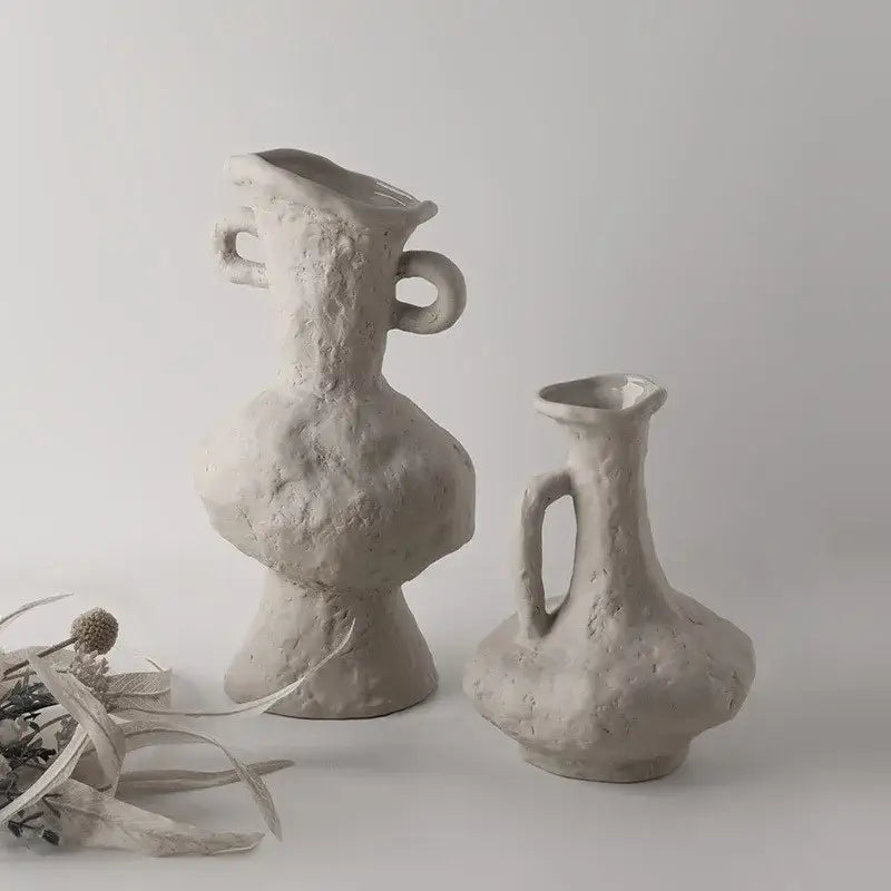 Two textured matte gray ceramic vases with handcrafted looped handles in nordic style ceramic flower pot white