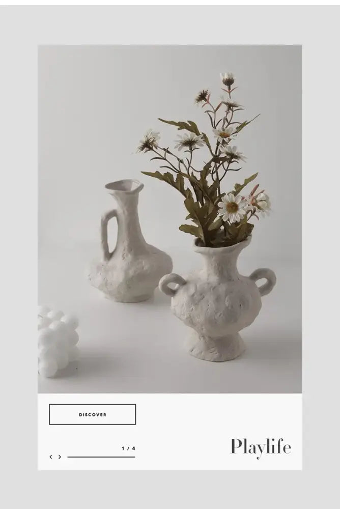 White ceramic nordic style flower pot with textured surface and two handles for decorative use by DecorBites