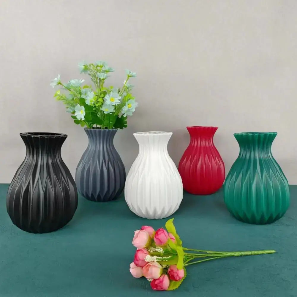 Set of five DecorBites™ ceramic flower vases in black gray white red and teal with ribbed textures in Nordic style