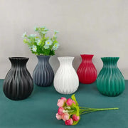 Set of five DecorBites™ ceramic flower vases in black gray white red and teal with ribbed textures in Nordic style