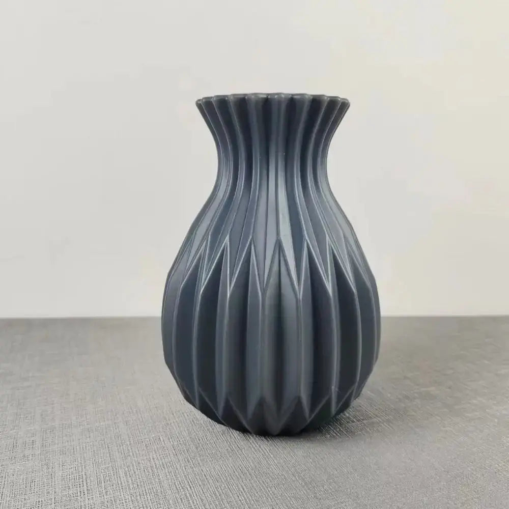Decorbites™ nordic style ceramic flower vase in matte dark gray with a geometric faceted design and fluted rim