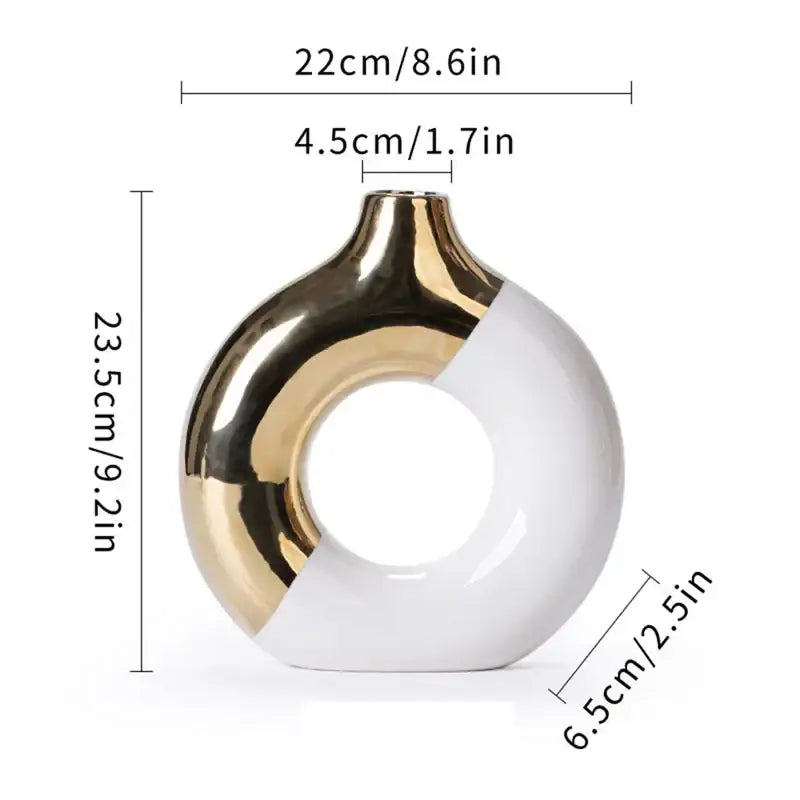 A nordic style circle vase by DecorBites in glossy white ceramic with metallic gold finish for flower arrangement