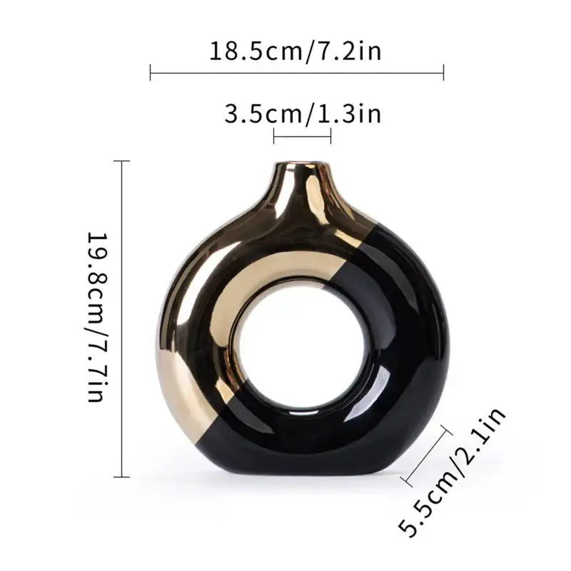 A sleek glossy black and gold ceramic nordic style circle vase with a modern ring design for flower arrangement