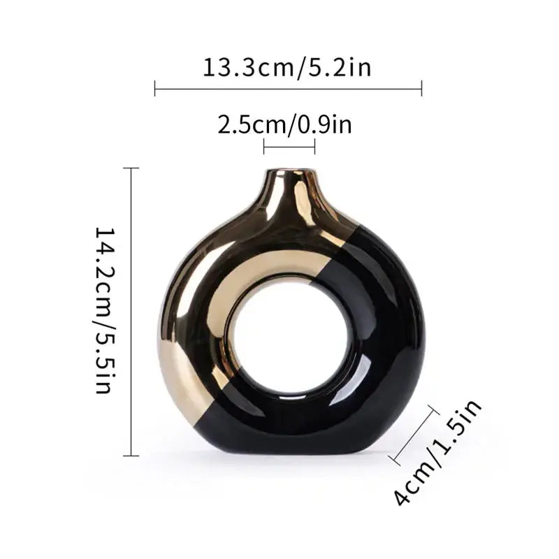 A sleek glossy black and gold ceramic nordic style circle vase with a modern ring design for flower arrangement