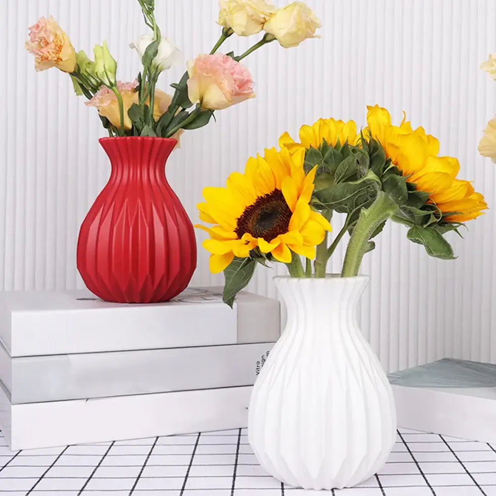 Red and white ribbed plastic flower vase by decorbites holding sunflowers and roses for home decor