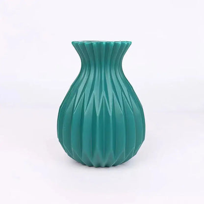 Teal-colored plastic flower vase with fluted geometric pattern from DecorBites™ nordic style home decor collection