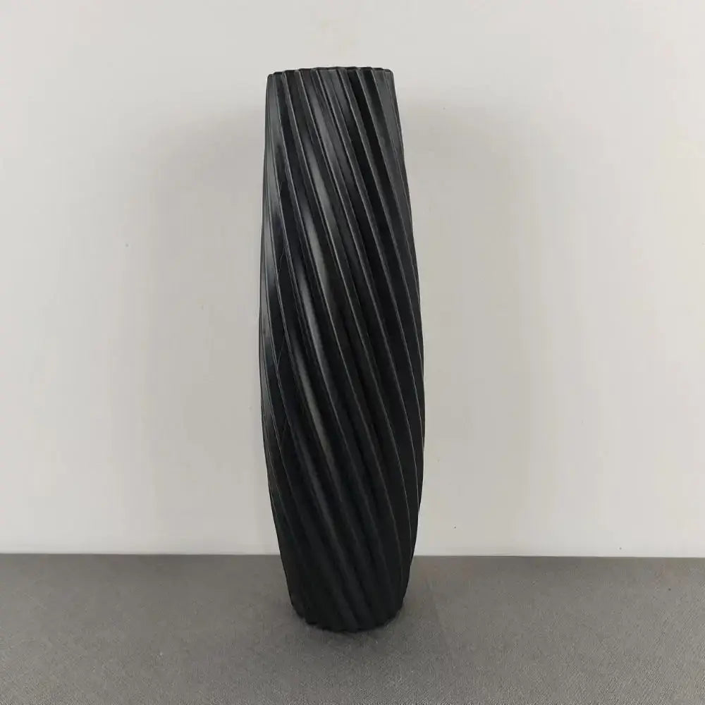 Black ceramic flower vase with a sleek twisted ribbed design from DecorBites™ nordic style plastic flower vase collection