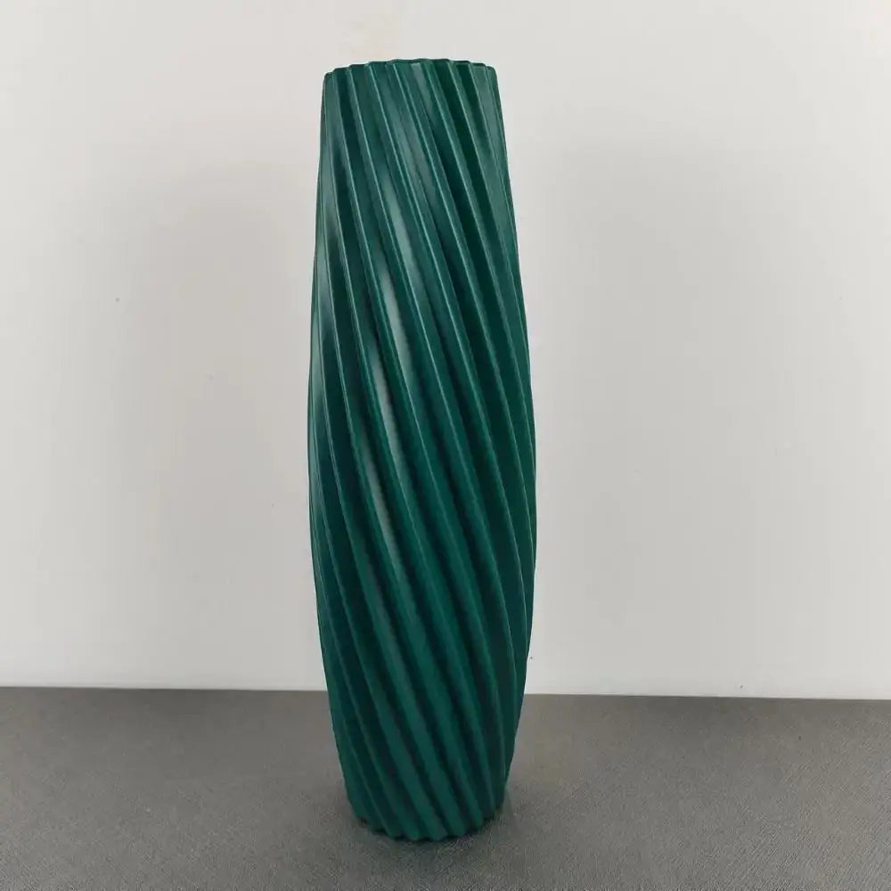 Deep green tall cylindrical plastic flower vase with twisted ribbed texture for home decor by decorbites™ nordic style