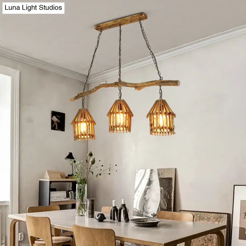 Rustic wooden house shaped pendant light with three woven bamboo shades and metal chains ideal for dining room lighting