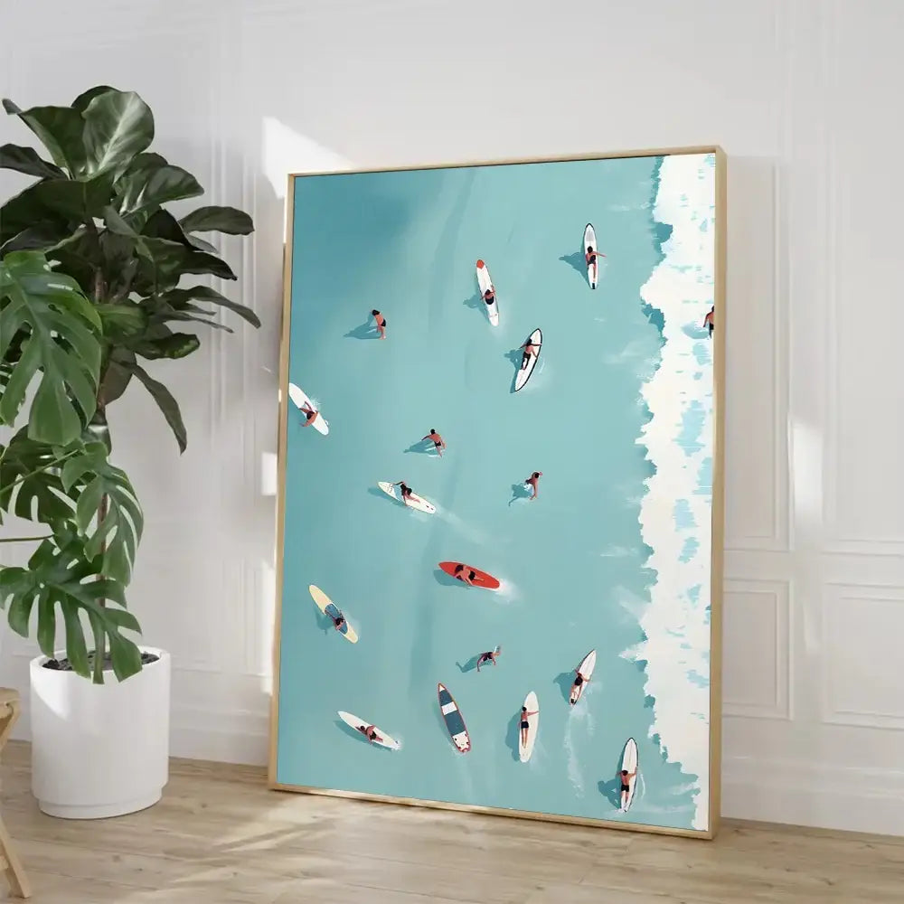 A framed DecorBites™ Nordic Summer wall art print featuring surfers in turquoise water with a gold minimalist frame
