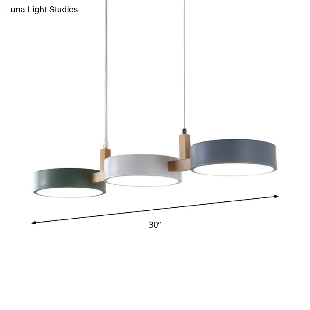 Modern three-light pendant fixture with matte sage green white and gray acrylic shades bulb included white warm light