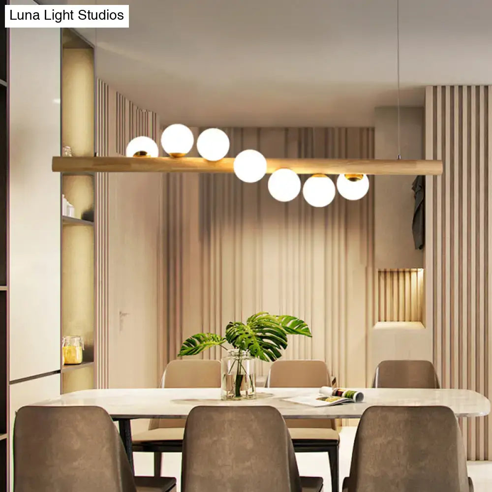Modern beige decorbites nordic wood island pendant with globe glass light and adjustable chain cord length for dining room