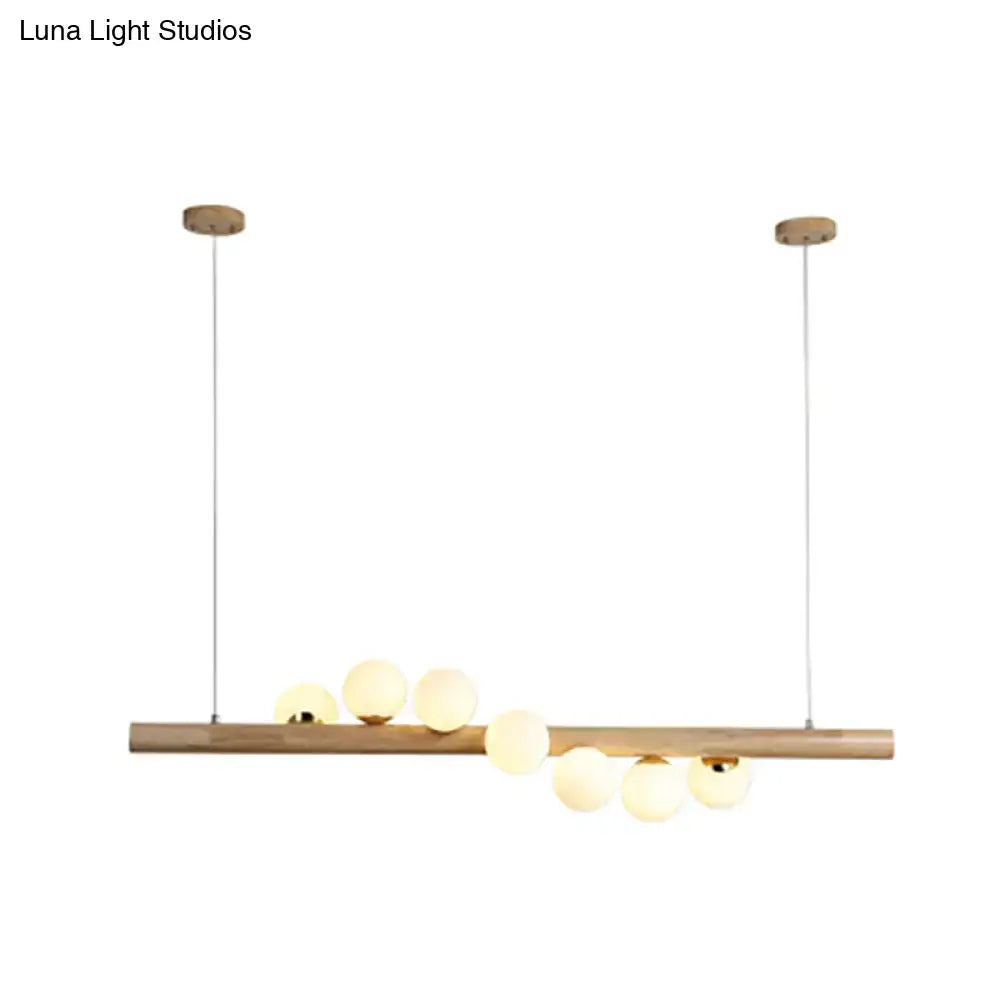DecorBites Nordic wood island pendant in beige with six warm glass globes and adjustable chain cord length for dining room