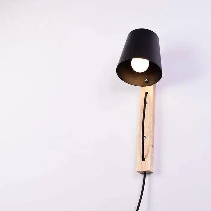 Black metal DecorBites™ Nordic Wood plug in wall sconce with light wood arm screws and black cord for mida wall sconce use
