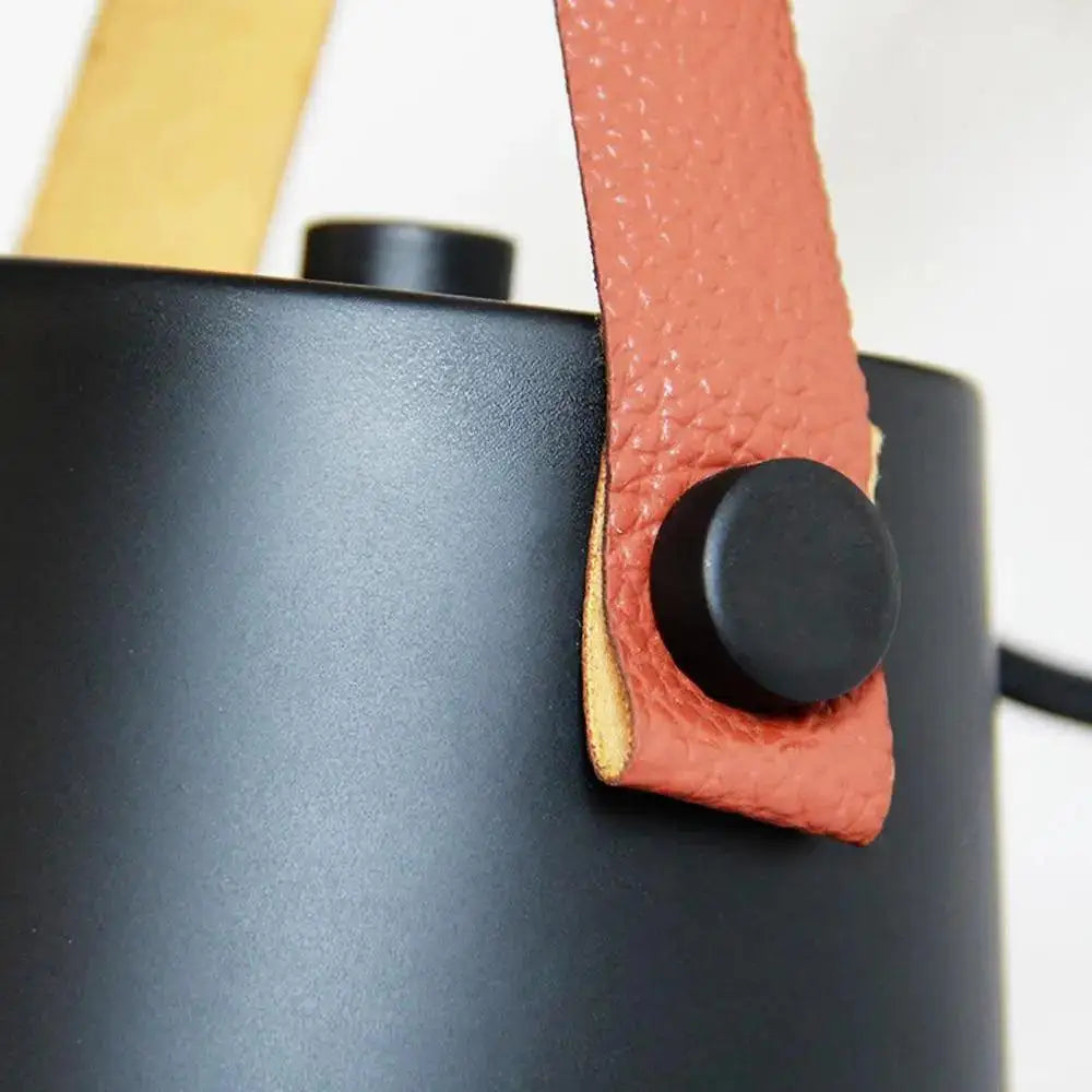 Decorbites™ nordic wooden wall lights feature a black matte cylindrical bucket with an orange leather strap and black clasp