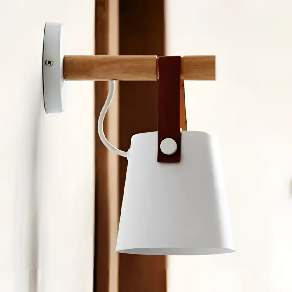 White ceramic lampshade with wooden arm and brown leather strap in DecorBites™ nordic wooden wall lights design