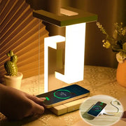 Modern geometric decorbites™ novelty floating lamp with white illuminated body green top and detachable wireless charger