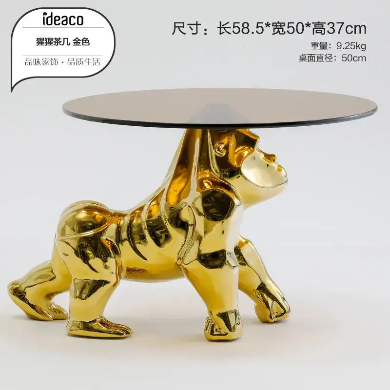 Golden gorilla-shaped decorbites octopus glass gold resin side table with sleek black glass top for living room accent