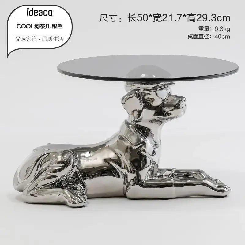 Silver metallic dog-shaped coffee table with round glass top featured in decorbites octopus glass gold resin side table design