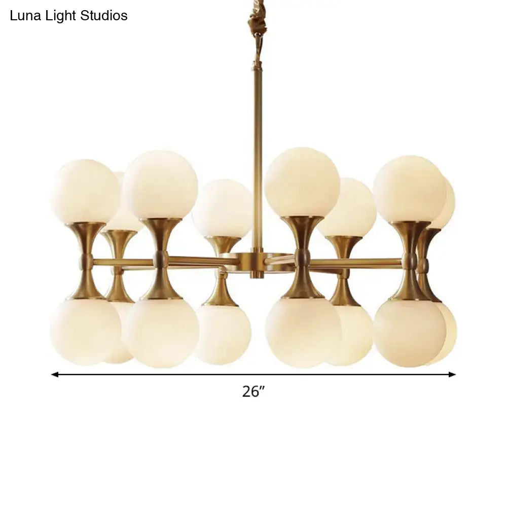 Brass finished decorbites opal glass chandelier light with 12 16 frosted globe heads in a modern ceiling design