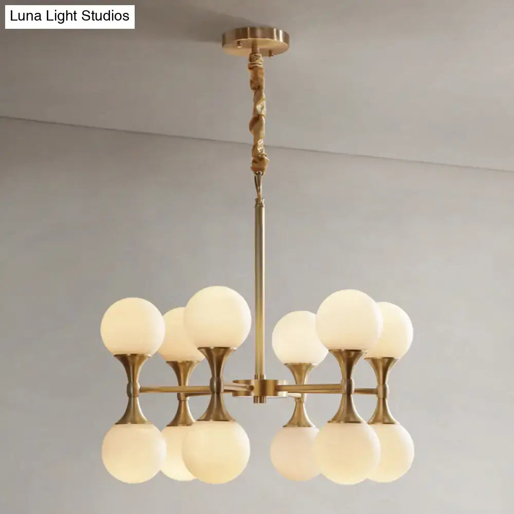 Brass-finished opal glass chandelier with eight frosted glass globe shades in two tiers for ceiling lighting