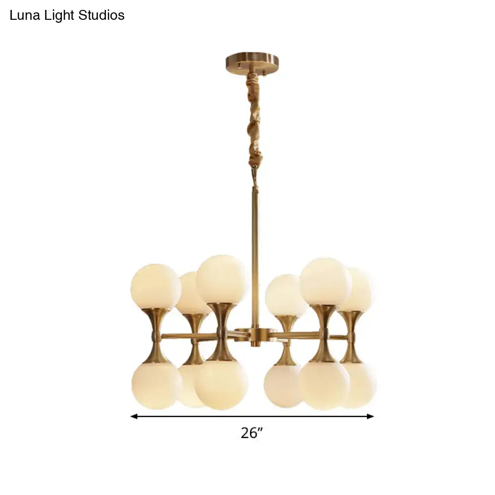 Gold-toned DecorBites™ opal glass chandelier light with eight frosted globe shades in two tiers for ceiling hanging