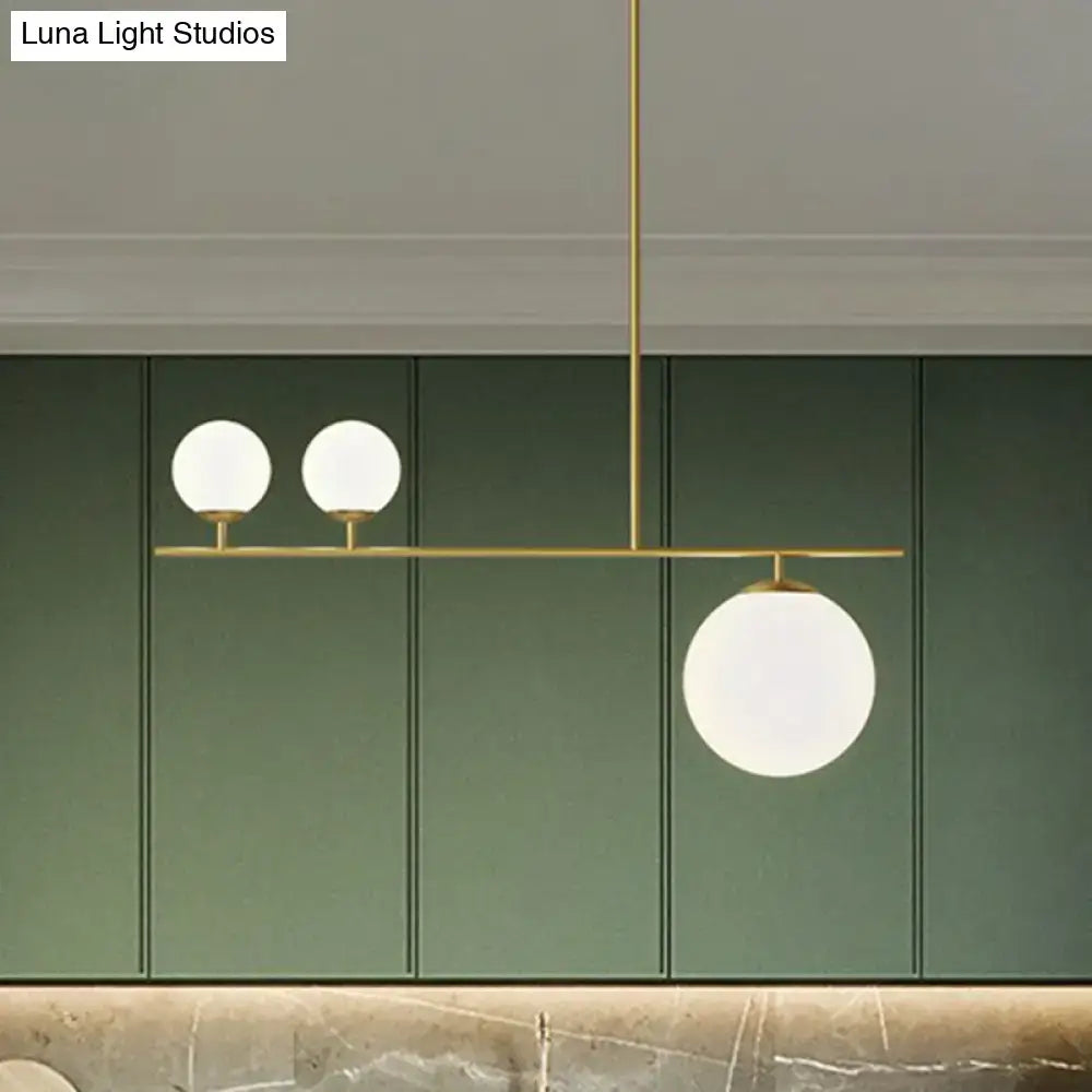 DecorBites™ opal glass globe pendant lamp with modern brass hanging lamp featuring three frosted simplicity globe shades