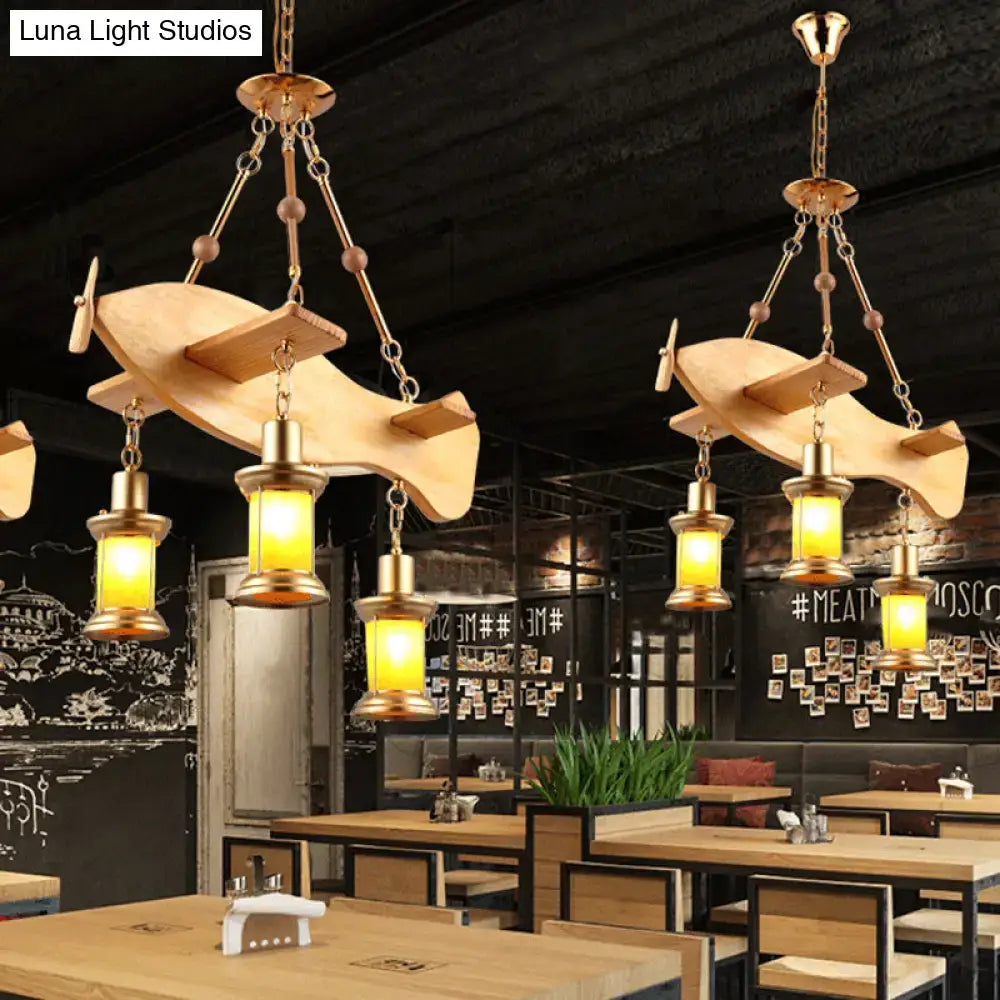 Decorbites™ wooden pendant light with fish guitar design features orange glass lanterns and brass accents