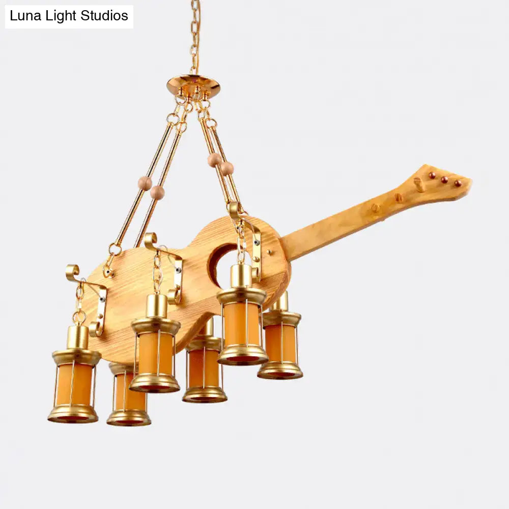 DecorBites orange glass pendant light with fish guitar design featuring wooden body and brass accents with amber lanterns