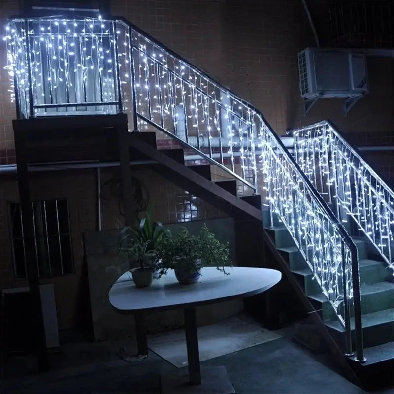 Decorbites™ outdoor christmas waterfall curtain string lights with bright white led bulbs draped on staircase railings