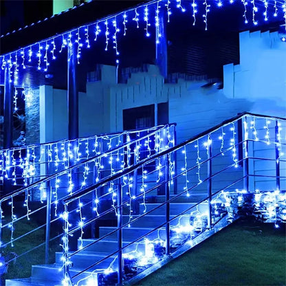 Decorbites™ outdoor christmas waterfall blue icicle curtain string lights hanging along porch staircase railing