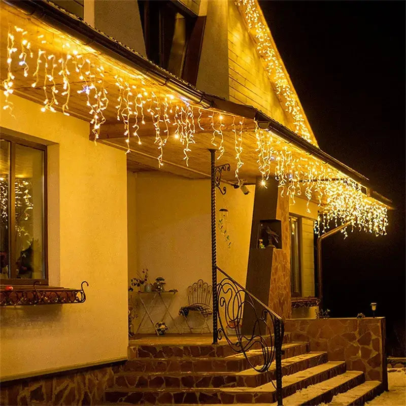 DecorBites™ warm white led outdoor Christmas waterfall lights curtain string draped on house eaves