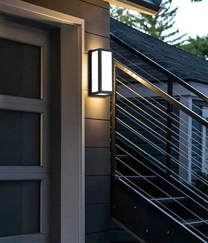 Modern black-framed rectangular led porch light with motion activated glowing white panel for outdoor use