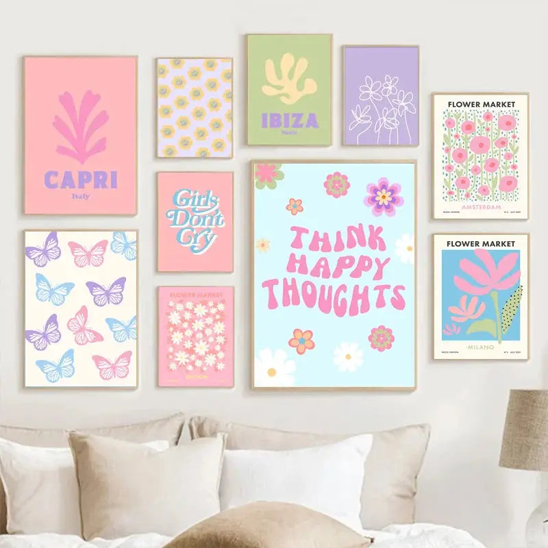 A collection of pastel-colored framed wall art featuring smiley flower canvas designs with floral and travel themes