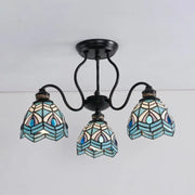 Stylish DecorBites™ peacock stained glass semi flush light with black metal frame and three blue teal shades