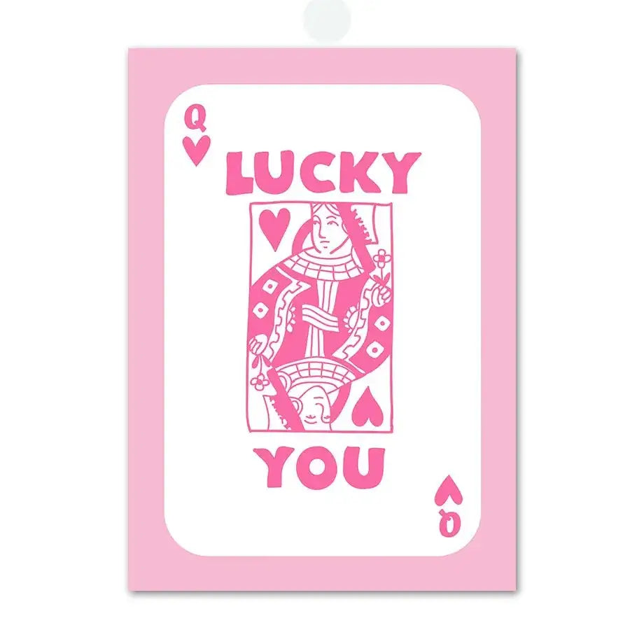 Decorbites pink angel number poster featuring a pink queen of hearts playing card with lucky you lettering