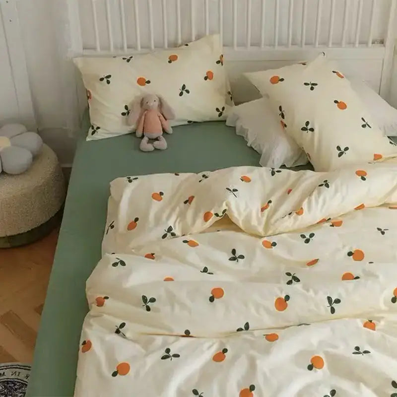 Cream-colored bedding set with playful orange and green fruit pattern from decorbites pink floral bedding collection queen size