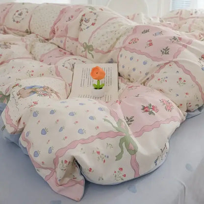Decorbites™ pink flowers duvet cover set featuring pastel pink and cream floral pattern with green ribbon accents for kids