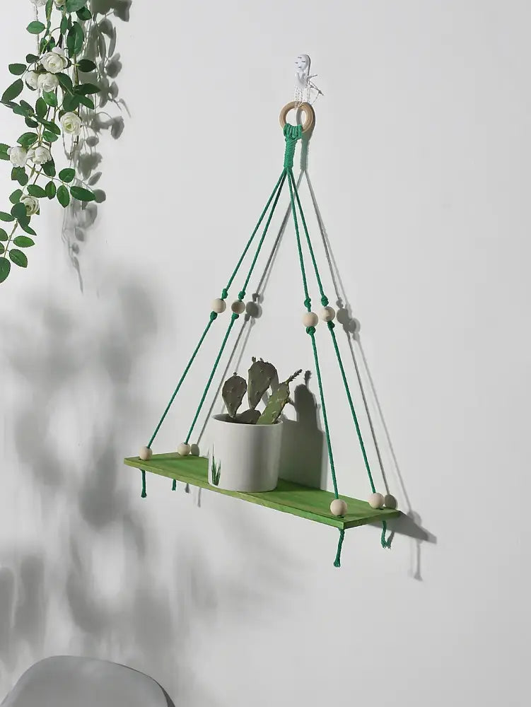 Green wooden decorbites™ macrame hanging shelf with wooden beads and natural wood ring for kids room