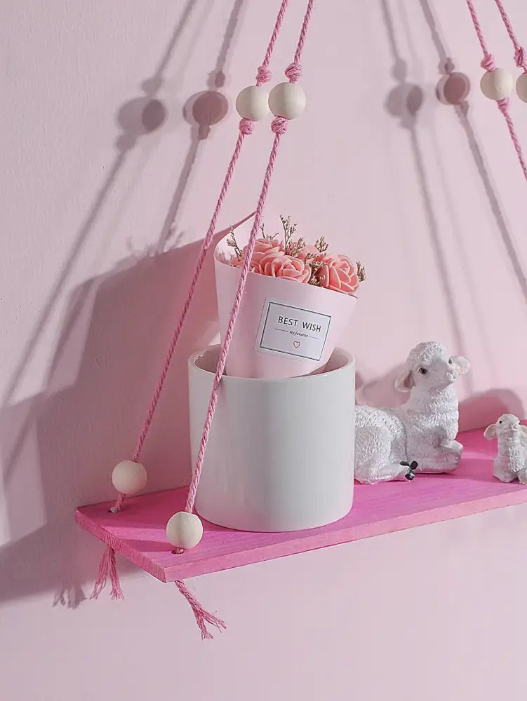 Pink macrame hanging shelf with wooden beads and tassels in decorbites pink green wooden wall shelf for kids room