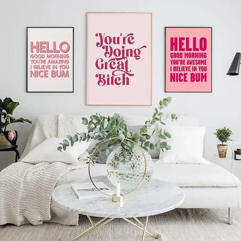 DecorBites pink makeup funny quote art poster beside a clear glass vase with gold metal ring holding eucalyptus branches