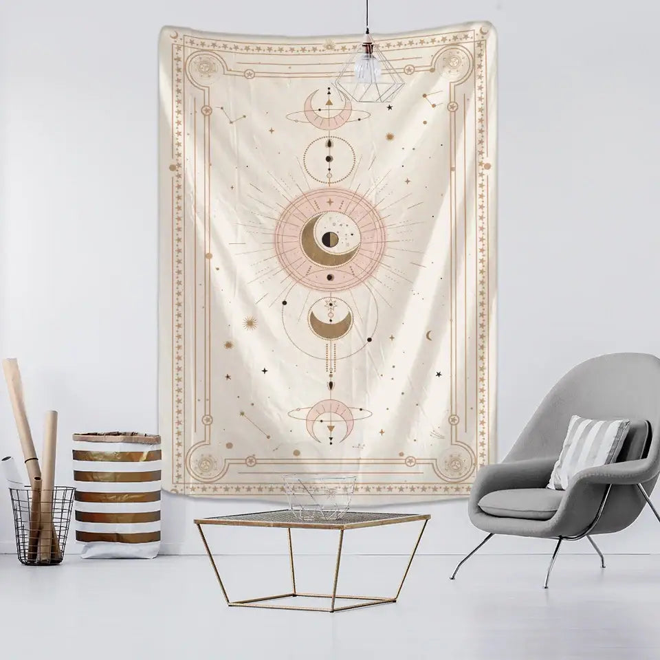 A cream-colored tapestry with intricate celestial designs in gold and soft pink accents pink planet tarot wall hanging
