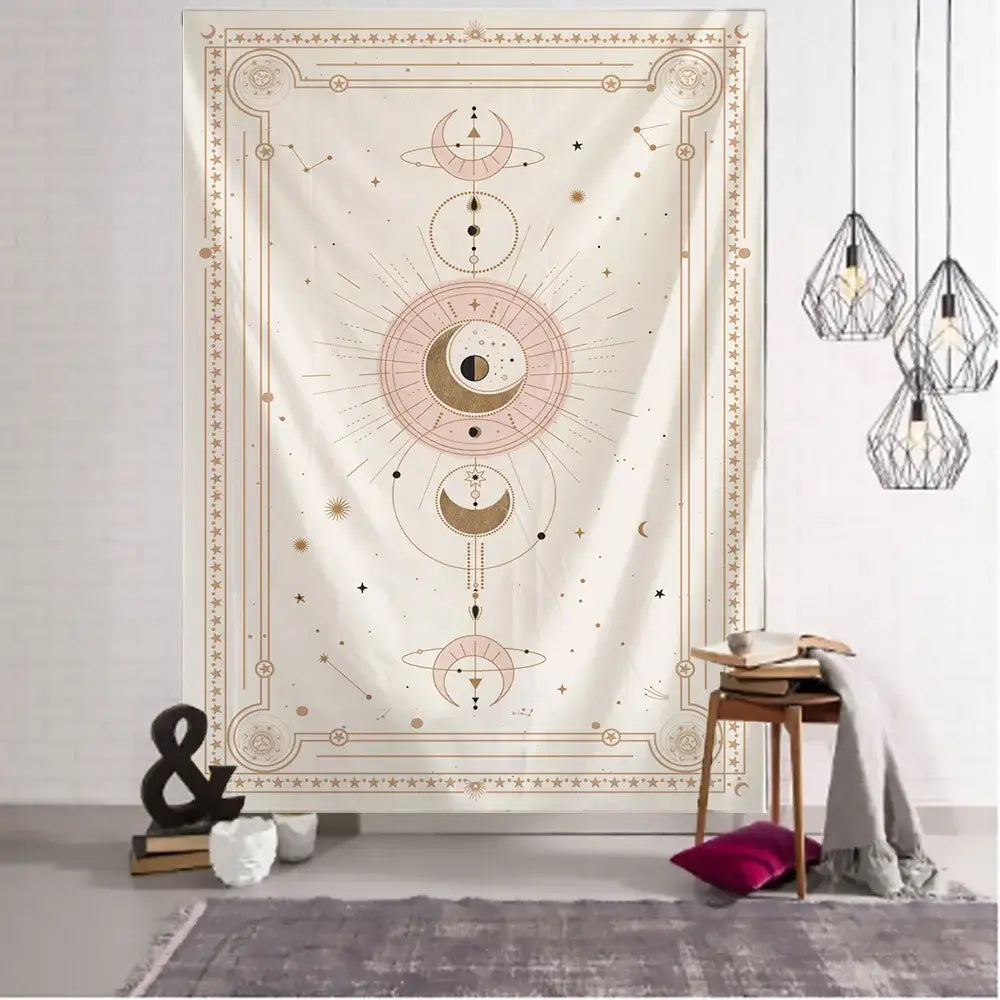 A cream-colored pink planet tarot tapestry wall hanging with gold and pink celestial designs and ornate borders