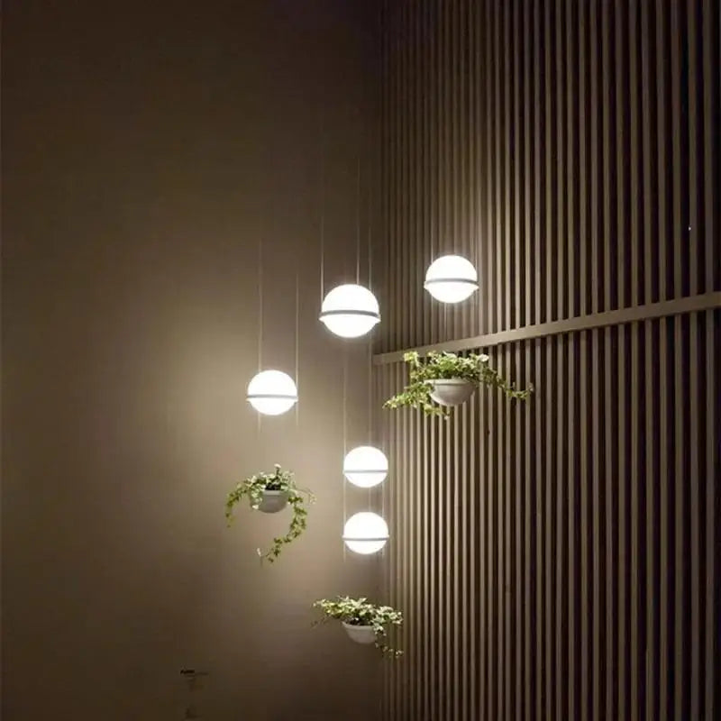 Modern white spherical DecorBites™ planter light pendant chandelier features integrated planters in a minimalist design